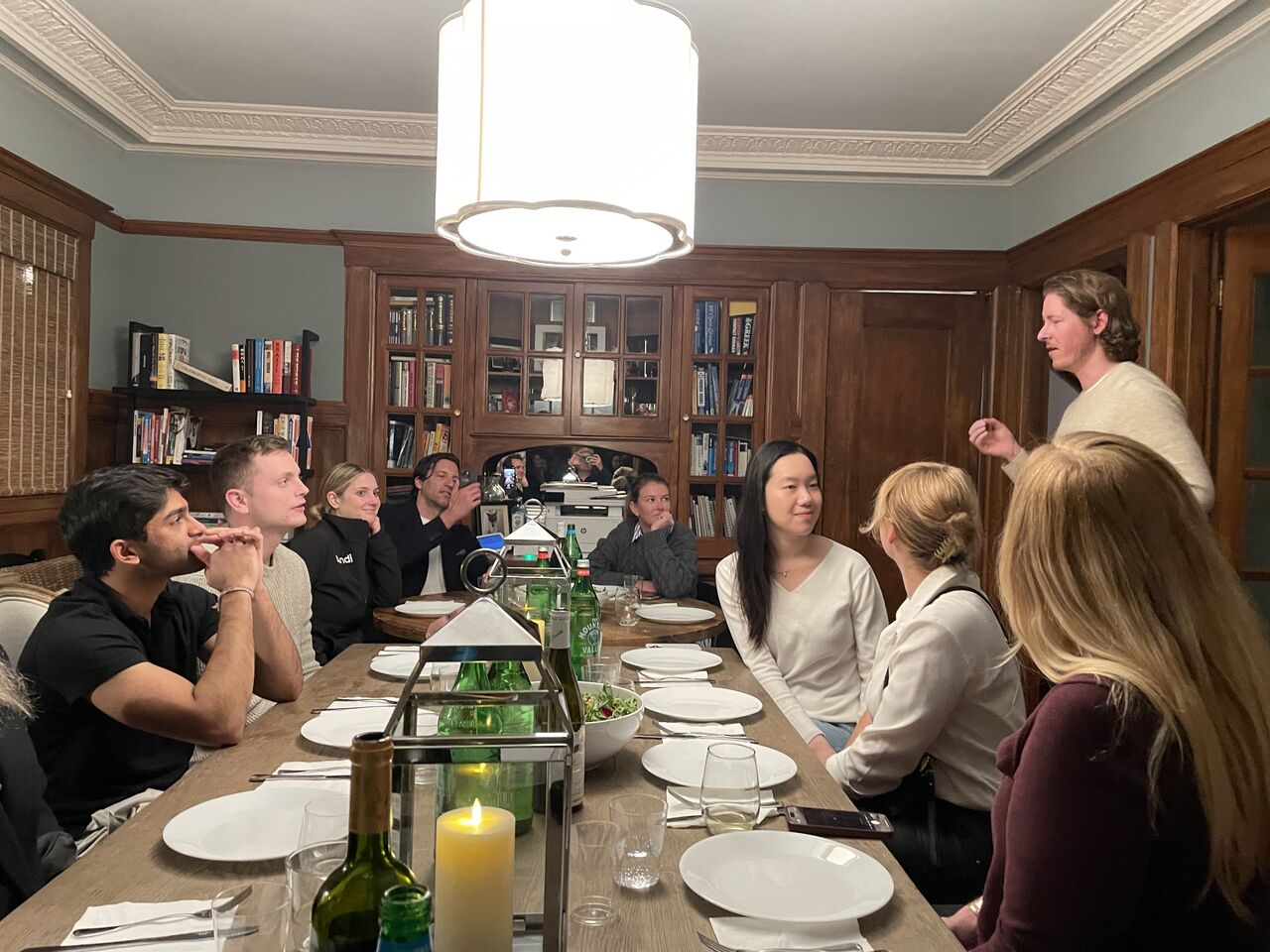 An intimate Open Future Forum dinner discussion in a private library setting