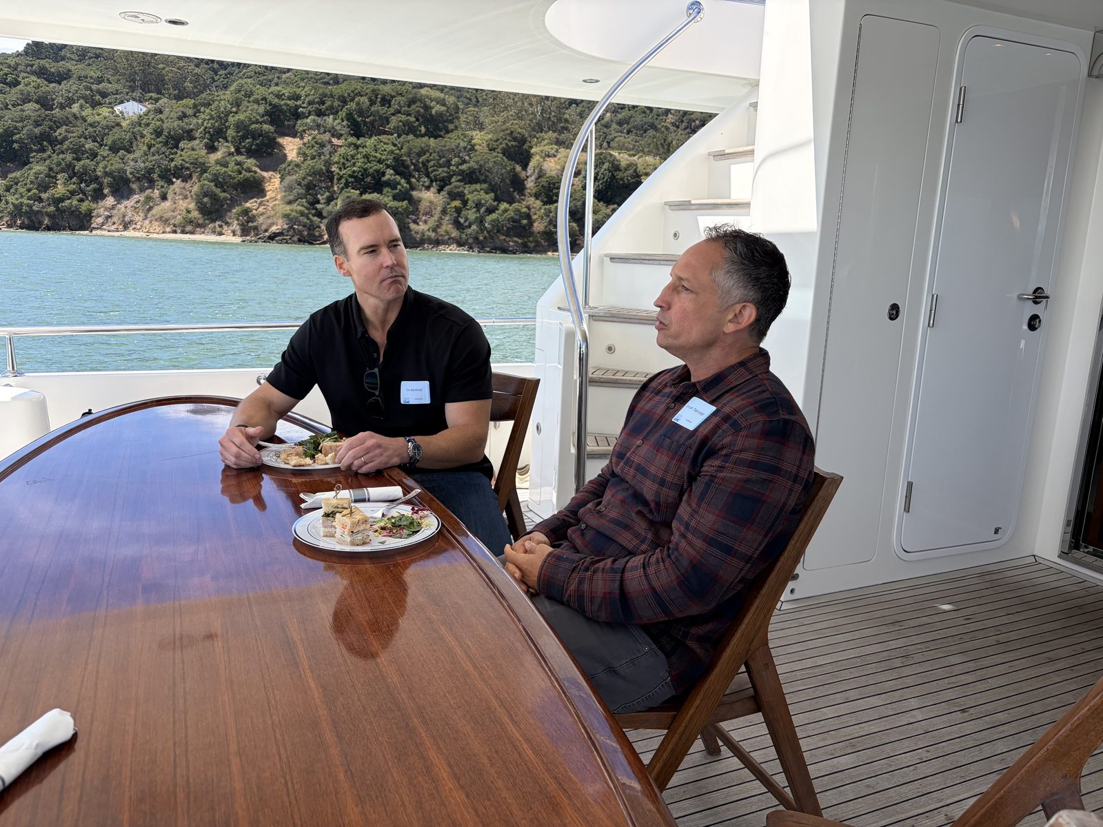 Open Future Forum members dining together on a boat